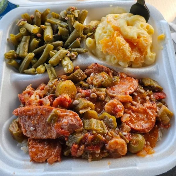 Tony's Seafood cajun meal with gumbo, green beans, and macaroni and cheese in a takeout container.